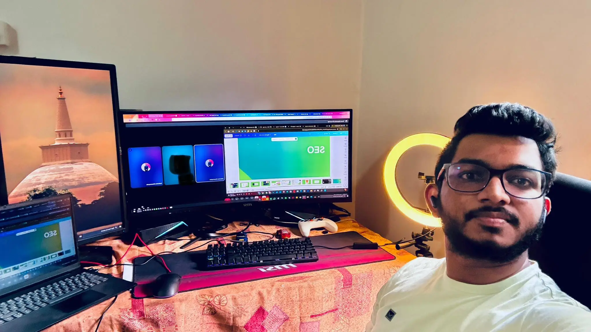 SEO Consultant Sathmina Dissanayake pictured at his dual-monitor workstation setup during a live client consultation call.